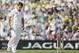 England's Simon Kerrigan returns to his mark to bowl to Australia's Steven Smith, unseen, during play on the first day of the fifth Ashes cricket Test at the Oval cricket ground in London, Wednesday, Aug. 21, 2013. (AP Photo/Alastair Grant)