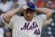 New York Mets pitcher Bartolo Colon (40) adjusts his cap before pitching against the Atlanta Braves in the second inning of a baseball game, Thursday, July 10, 2014, in New York. (AP Photo/Julie Jacobson)