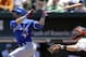 Toronto Blue Jays' Jose Bautista, left, watches his double in the first inning of a baseball game against the Baltimore Orioles, Sunday, June 15, 2014, in Baltimore. Blue Jays' Jose Reyes scored on the play. (AP Photo/Patrick Semansky)