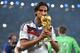 RIO DE JANEIRO, BRAZIL - JULY 13: Sami Khedira of Germany kisses the World Cup trophy after defeating Argentina 1-0 in extra time during the 2014 FIFA World Cup Brazil Final match between Germany and Argentina at Maracana on July 13, 2014 in Rio de Janeiro, Brazil. (Photo by Matthias Hangst/Getty Images)