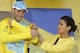 Italy's Vincenzo Nibali, puts on the overall leader's yellow jersey, celebrates on the podium of the tenth stage of the Tour de France cycling race over 161.5 kilometers (100.4 miles) with start in Mulhouse and finish in La Planche des Belles Filles, France, Monday, July 14, 2014. (AP Photo/Laurent Cipriani)