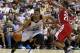 Milwaukee Bucks' Jabari Parker drives by Cleveland Cavaliers' Andrew Wiggins during an NBA summer league basketball game Friday, July 11, 2014, in Las Vegas. (AP Photo/John Locher)