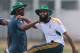 South African test cricket captain Hashim Amla, right, swings his leg during a training session before their warm up game against Sri Lanka Board XI in Moratuwa on the outskirts of Colombo, Sri Lanka, Thursday, July 3, 2014. (AP Photo/Eranga Jayawardena)
