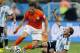 Argentina's Lucas Biglia, right, calls for medical treatment after colliding with Netherlands' Daryl Janmaat during the World Cup semifinal soccer match between the Netherlands and Argentina at the Itaquerao Stadium in Sao Paulo, Brazil, Wednesday, July 9, 2014. (AP Photo/Frank Augstein)