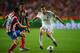 LISBON, PORTUGAL - MAY 24: Angel Di Maria of Real Madrid takes on Juanfran (L) and Jose Sosa of Club Atletico de Madrid (C) during the UEFA Champions League Final between Real Madrid and Atletico de Madrid at Estadio da Luz on May 24, 2014 in Lisbon, Portugal. (Photo by Michael Regan/Getty Images)