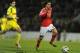 CORRECTS NAME OF PLAYER - Benfica's Lazar Markovic, from Serbia, drives the ball past Pacos Ferreira's Helder Lopes, left, to score his team second goal in a Portuguese League soccer match at Mata Real stadium in Pacos de Ferreira, northern Portugal, Sunday, Feb. 16, 2014. (AP Photo/Paulo Duarte)
