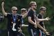 Team captain Philipp Lahm celebrates with his teammate during a fan party after the arrival of the German national soccer team in Berlin Tuesday, July 15, 2014. Germany beat Argentina 1-0 on Sunday to win its fourth World Cup title. (AP Photo/Petr David Josek)