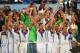 RIO DE JANEIRO, BRAZIL - JULY 13: Philipp Lahm of Germany raises the World Cup trophy with teammates after defeating Argentina 1-0 in the 2014 FIFA World Cup Brazil Final match between Germany and Argentina at Maracana on July 13, 2014 in Rio de Janeiro, Brazil. (Photo by Laurence Griffiths/Getty Images)