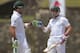South African batsman Dean Elgar celebrates scoring a half century with Faf du Plessis during the first day of the first test cricket match between Sri Lanka and South Africa in Galle, Sri Lanka, Wednesday, July 16, 2014. (AP Photo/Eranga Jayawardena)