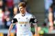 SWANSEA, WALES - MARCH 15: Ben Davies of Swansea City in action during the Barclays Premier League match between Swansea City and West Bromwich Albion at Liberty Stadium on March 15, 2014 in Swansea, Wales. (Photo by Tom Dulat/Getty Images)