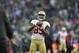 FILE - In this Jan. 19, 2014, file photo, San Francisco 49ers' Vernon Davis warms up before the NFC Championship game against the Seattle Seahawks in Seattle. After a quick trip to the Sochi Olympics as USA Curling's honorary captain, 49ers tight end Vernon Davis is back in the Bay Area gearing up for a busy offseason of training and activities when he begins his regular routine in the coming weeks. (AP Photo/Marcio Jose Sanchez, File)