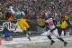 Green Bay Packers tight end Brandon Bostick reaches to try to make a catch while being covered by Atlanta Falcons outside linebacker Sean Weatherspoon during an NFL football game Sunday, Dec. 8, 2013, in Green Bay, Wis. (AP Photo/Matt Ludtke)