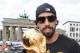 BERLIN, GERMANY - JULY 15: Sami Khedira celebrates on the open top bus at the German team victory ceremony on July 15, 2014 in Berlin, Germany. Germany won the 2014 FIFA World Cup Brazil match against Argentina in Rio de Janeiro on July 13. (Photo by Markus Gilliar - Pool/Getty Images)