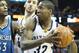 Mar 24, 2014; Memphis, TN, USA; Memphis Grizzlies forward Ed Davis (32) drives against Minnesota Timberwolves forward Dante Cunningham (33) as Grizzlies center Kosta Koufus (41) looks on during the first half at FedExForum. Mandatory Credit: Nelson Chenault-USA TODAY Sports