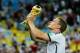 RIO DE JANEIRO, BRAZIL - JULY 13: Matthias Ginter celebrates with the trophy after defeating Argentina 1-0 in extra time during the 2014 FIFA World Cup Brazil Final match between Germany and Argentina at Maracana on July 13, 2014 in Rio de Janeiro, Brazil. (Photo by Matthias Hangst/Getty Images)