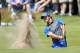 Rory McIlroy of Northern Ireland plays out of a bunker on the 16th hole during the first day of the British Open Golf championship at the Royal Liverpool golf club, Hoylake, England, Thursday July 17, 2014. (AP Photo/Peter Morrison)