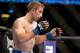 Oct 5, 2012; Minneapolis, MN, USA; Phil Harris gets position to bout Darren Uyenoyama (not pictured) at the UFC on FX 5 at the Target Center. Mandatory Credit: Bruce Kluckhohn-USA TODAY Sports