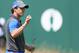 Rory McIlroy of Northern Ireland holds up his ball on the 18th green after his round on the first day of the British Open Golf championship at the Royal Liverpool golf club, Hoylake, England, Thursday July 17, 2014. (AP Photo/Peter Morrison)