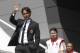 AC Milan coach Filippo Inzaghi waves during the presentation of the upcoming 2014-15 season at the AC Milan headquarter in Milan, Italy, Thursday, July 10, 2014. In background are midfielder Riccardo Montolivo and forward Giampaolo Pazzini. (AP Photo/Luca Bruno)