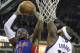 Detroit Pistons forward Josh Smith, left, goes to the basket against Sacramento Kings center DeMarcus Cousins during the first quarter of an NBA basketball game in Sacramento, Calif., Friday, Nov. 15, 2013.The Pistons won 97-90 (AP Photo/Rich Pedroncelli)