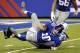 New York Giants quarterback Eli Manning (10) is sacked by Indianapolis Colts outside linebacker Erik Walden (93) during the first half of an NFL preseason football game Sunday, Aug. 18, 2013, in East Rutherford, N.J. (AP Photo/Bill Kostroun)