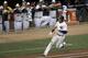 Shortstop Derek Jeter, of the New York Yankees, doubles during the first inning of the MLB All-Star baseball game, Tuesday, July 15, 2014, in Minneapolis. (AP Photo/Paul Sancya)