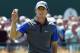 Jul 17, 2014; Wirral, Merseyside, GBR; Rory McIlroy walks off the 18th green during after finishing the first round of The 143rd Open Championship at the Royal Liverpool Golf Club. Mandatory Credit: Ian Rutherford-USA TODAY Sports