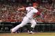 St. Louis Cardinals' Matt Holliday watches his RBI double during the fifth inning of a baseball game against the New York Mets Tuesday, June 17, 2014, in St. Louis. (AP Photo/Jeff Roberson)