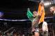 Conor McGregor, of Ireland, leaves the ring draped in an Irish flag after beathing Max Holloway in their UFC on Fox Sports 1 mixed martial arts bout in Boston, Saturday, August 17,2013. McGregor won via unanimous decision. (AP Photo/Gregory Payan)