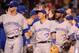 ANAHEIM, CA - JULY 08: Jose Reyes #7 and Munenori Kawasaki #66 and Nolan Reimold #14 of the Toronto Blue Jays bow celebrate a 4-0 win over the Los Angeles Angels at Angel Stadium of Anaheim on July 8, 2014 in Anaheim, California. (Photo by Harry How/Getty Images)