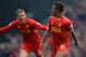 NORWICH, ENGLAND - APRIL 20: Raheem Sterling of Liverpool celebrates scoring the opening goal with Lucas Leiva of Liverpool during the Barclays Premier League match between Norwich City and Liverpool at Carrow Road on April 20, 2014 in Norwich, England. (Photo by Michael Regan/Getty Images)