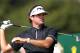 Bubba Watson of the US watches his shot off the 10th tee during the first day of the British Open Golf championship at the Royal Liverpool golf club, Hoylake, England, Thursday July 17, 2014. (AP Photo/Scott Heppell)