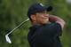 Tiger Woods of the US plays a shot off the 8th tee during the second day of the British Open Golf championship at the Royal Liverpool golf club, Hoylake, England, Friday July 18, 2014. (AP Photo/Peter Morrison)