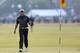 Rory McIlroy of Northern Ireland walks up to the 18th green during the second day of the British Open Golf championship at the Royal Liverpool golf club, Hoylake, England, Friday July 18, 2014. (AP Photo/Scott Heppell)