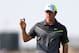 Rory McIlroy of Northern Ireland holds up his ball after playing a birdie on the 8th green during the second day of the British Open Golf championship at the Royal Liverpool golf club, Hoylake, England, Friday July 18, 2014. (AP Photo/Scott Heppell)