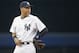 New York Yankees shortstop Derek Jeter looks over his shoulder while waiting for the start of a baseball game against the Oakland Athletics at Yankee Stadium in New York, Wednesday, June 4, 2014. (AP Photo/Kathy Willens)