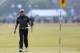 Rory McIlroy of Northern Ireland walks up to the 18th green during the second day of the British Open Golf championship at the Royal Liverpool golf club, Hoylake, England, Friday July 18, 2014. (AP Photo/Scott Heppell)