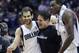 Dallas Mavericks owner Mark Cuban, center, celebrates with Mavericks Jose Calderon, left, of Spain as Samuel Dalembert looks on after the NBA basketball game against the Houston Rockets in Dallas, Wednesday, Nov. 20, 2013. The Mavericks won 123-120. (AP Photo/LM Otero)