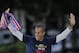 Atletico de Madrid's Joao Miranda from Brazil celebrates in Neptuno Square in Madrid, Spain, Saturday, May 18, 2013. Atletico de Madrid defeated Real Madrid in the Copa del Rey final soccer match on Friday. (AP Photo/Andres Kudacki)