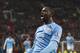 Manchester City's Yaya Toure celebrates after scoring against Manchester United during their English Premier League soccer match at Old Trafford Stadium, Manchester, England, Tuesday, March 25, 2014. (AP Photo/Jon Super)