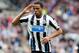 Newcastle United's Loic Remy celebrates his goal during their English Premier League soccer match against Cardiff City at St James' Park, Newcastle, England, Saturday, May 3, 2014. (AP Photo/Scott Heppell)