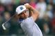 Rickie Fowler of the US plays a shot off the 4th tee during the third day of the British Open Golf championship at the Royal Liverpool golf club, Hoylake, England, Saturday July 19, 2014. (AP Photo/Scott Heppell)