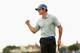HOYLAKE, ENGLAND - JULY 19: Rory McIlroy of Northern Ireland celebrates holing an eagle putt on the 16th green during the third round of The 143rd Open Championship at Royal Liverpool on July 19, 2014 in Hoylake, England. (Photo by Mike Ehrmann/Getty Images)