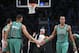 Boston Celtics guard Rajon Rondo (9) and guard Avery Bradley (0) celebrate during the second half of an NBA basketball game at the Barclays Center, Friday, March 21, 2014, in New York. The Nets defeated the Celtics, 114-98. (AP Photo/John Minchillo)