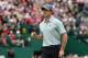 HOYLAKE, ENGLAND - JULY 19: Rory McIlroy of Northern Ireland celebrates holing an eagle putt on the 18th green during the third round of The 143rd Open Championship at Royal Liverpool on July 19, 2014 in Hoylake, England. (Photo by Andrew Redington/Getty Images)