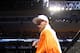 Conor McGregor, of Ireland, leaves the ring draped in an Irish flag after beathing Max Holloway in their UFC on Fox Sports 1 mixed martial arts bout in Boston, Saturday, August 17,2013. McGregor won via unanimous decision. (AP Photo/Gregory Payan)