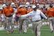 Texas coach Charlie Strong calls out to his players during the first half of the team's Orange and White spring NCAA college football game, Saturday, April 19, 2014, in Austin, Texas. (AP Photo/Michael Thomas)