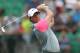 Rory McIlroy of Northern Ireland plays his tee shot from the 4th during the final round of the British Open Golf championship at the Royal Liverpool golf club, Hoylake, England, Sunday July 20, 2014. (AP Photo/Peter Morrison)