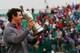 HOYLAKE, ENGLAND - JULY 20: Rory McIlroy of Northern Ireland holds the Claret Jug aloft after his two-stroke victory at The 143rd Open Championship at Royal Liverpool on July 20, 2014 in Hoylake, England. (Photo by Tom Pennington/Getty Images)