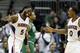 Atlanta Hawks' DeMarre Carroll, left, high-fives teammate Jeff Teague after scoring a basket in the fourth quarter of an NBA basketball game against the Boston Celtics, Wednesday, April 9, 2014, in Atlanta. Atlanta won 105-97. (AP Photo/David Goldman)